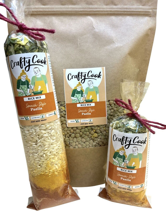All-purpose Crafty Cook Paella Rice Mix, gluten-free and vegan, shown in a cooking bowl with colorful vegetables and saffron threads.