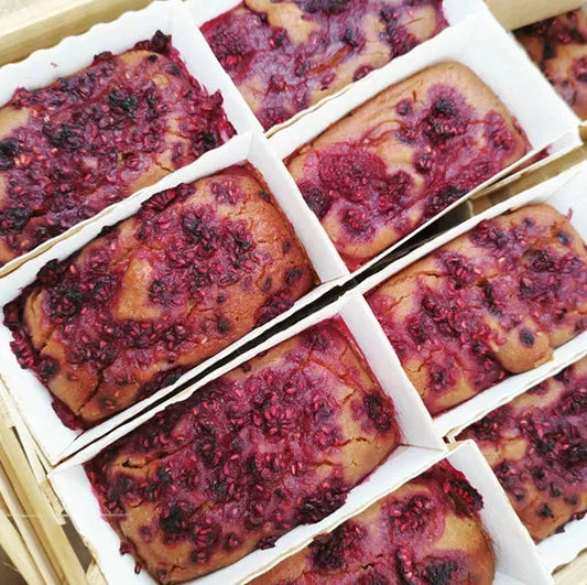 Vegan peanut butter and jam free-from cake from The Healthy Cake Company, sliced to show layers and filling.