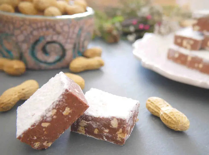 Gorvett & Stone peanut butter meltaways, creamy chocolate meltaways with peanut butter filling, displayed on a plate with ingredients.