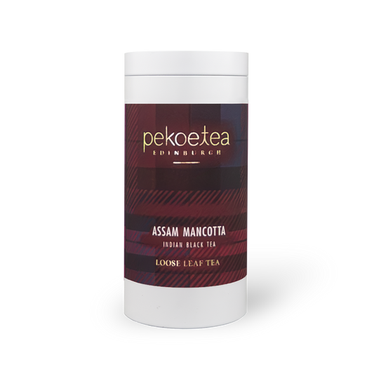 PekoeTea Edinburgh Mancotta Assam tea in a decorative caddy, showing the tea package with branding and design details.