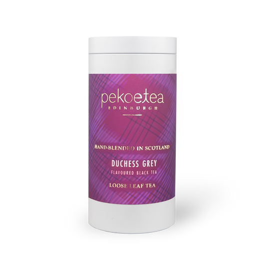 Tin of PekoeTea Edinburgh Duchess Grey tea with a decorative grey caddy and elegant packaging.