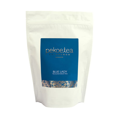Blue Lady flavoured black tea in a resealable PekoeTea Edinburgh pouch, showcasing vibrant blue and black tea leaves.