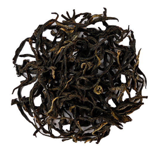 Golden Kinnettles Scottish Grown Tea leaves from PekoeTea Edinburgh, showing fresh, dried tea leaves in a natural setting.