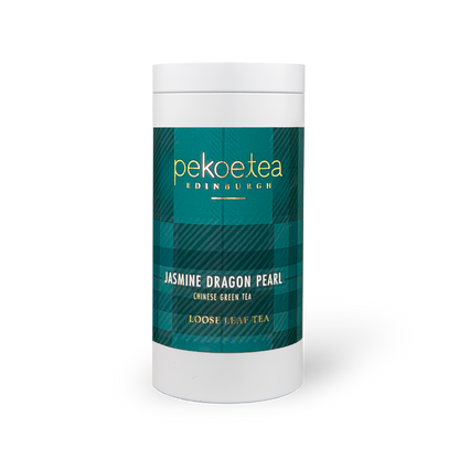 PekoeTea Edinburgh Jasmine Dragon Pearl green tea in a decorative caddy with tightly rolled green tea pearls and jasmine blossoms.