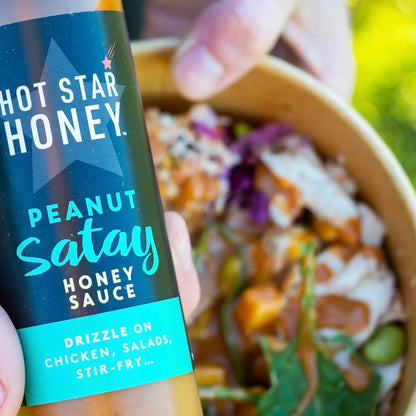 Hot Star Honey Honey Harmony Collection gift set with honey satay served on an Asian dish, showcasing a flavorful, artisanal presentation.