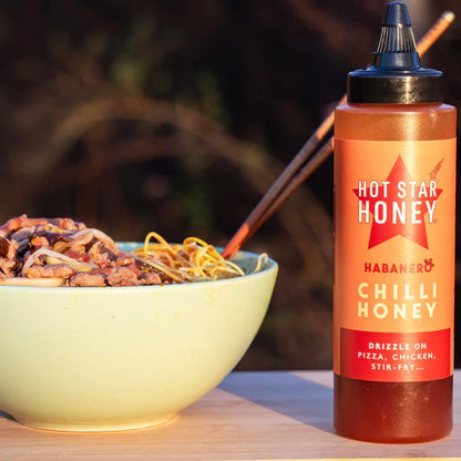 Hot Star Honey Chilli Honey jar with habanero peppers, ideal for stir-fry and spicy dishes.