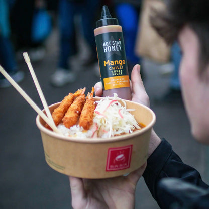 Asian-inspired Mango Chilli Honey Sauce by Hot Star Honey, featuring fresh mango on a dish with chili and honey glaze.