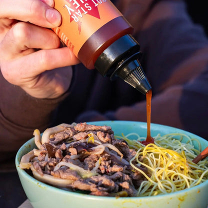Habanero hot chili honey from Hot Star Honey drizzled over a stir-fry with fresh peppers and vegetables.