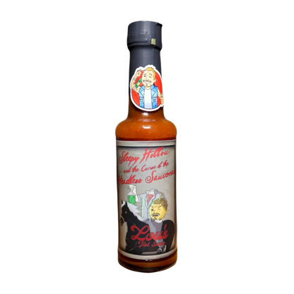 Bottle of Sleepy Hollou & The Curse of the Headless Sauceman Pumpkin Spice Hot Sauce by Lou's Brews, with label and spicy sauce visible.