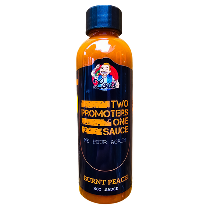Two bottles of Lou's Brews Burnt Peach Hot Sauce featuring vibrant labels and fiery orange sauce in clear glass bottles.