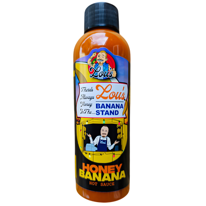Bottle of Lou's Brews banana and honey sauce, a condiment with banana and honey flavor, in a clear glass jar with a label.