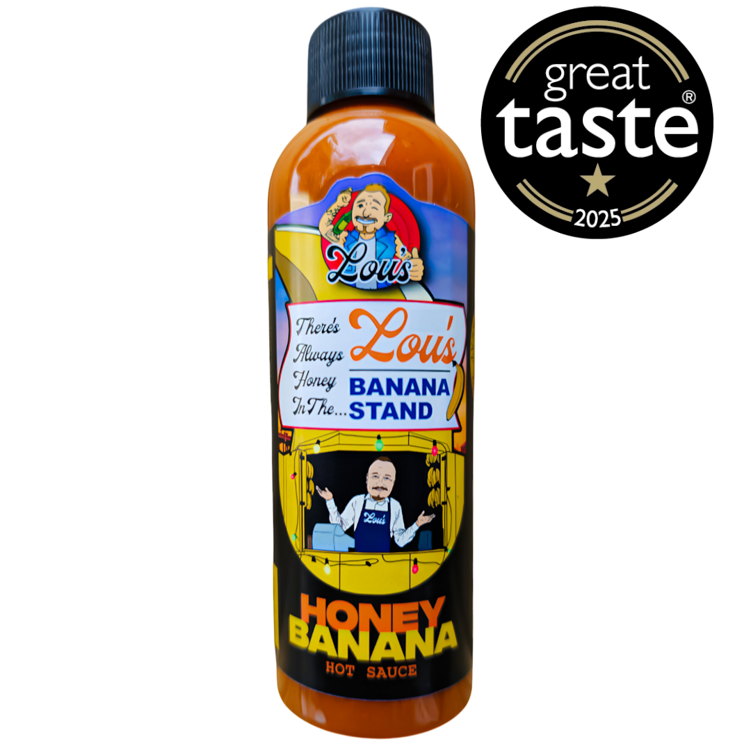 Banana and honey sauce condiment jar from Lou's Brews, showcasing the colorful label and thick, golden sauce inside