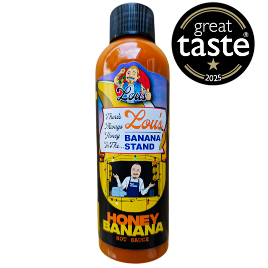 Banana and honey sauce condiment jar from Lou's Brews, showcasing the colorful label and thick, golden sauce inside