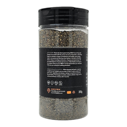 Black Magic Charcoal Beef Rub by FireFly Barbecue, a smoky BBQ rub with black and charcoal-colored spices on a wooden surface.