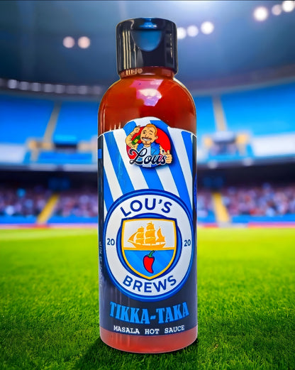Brightly labeled Tikka Taka Masala Hot Sauce bottle from Lou's Brews featuring vibrant packaging and spicy sauce inside.
