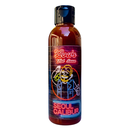 Seoul Calibur Kimchi Hot Sauce bottle by Lou's Brews, spicy condiment with vibrant label, in a condiment bottle on a white background.