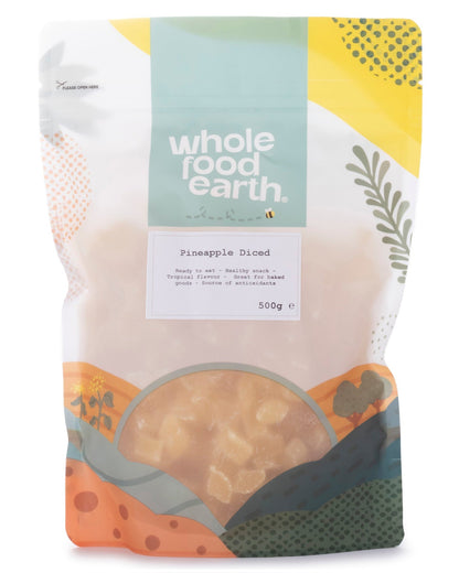 Dried diced pineapple pieces from Whole Food Earth, showing golden yellow dried fruit in a clear container.