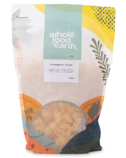Dried pineapple diced pieces in a clear container, from Whole Food Earth dried fruits collection.