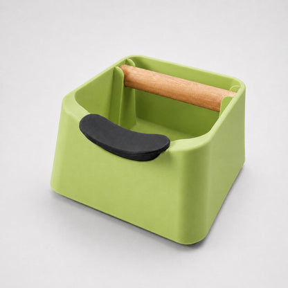 KNOCDIC® The Pod 3-in-1 espresso knock box with portafilter stand and oak wood knock bar in apple green for coffee grounds.