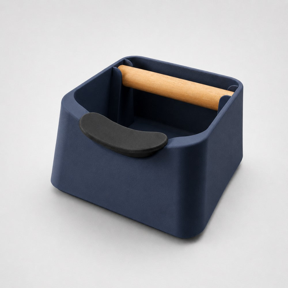 Dark blue KNOCDIC® Pod 3-in-1 espresso knock box with portafilter stand and oak wood knock bar for coffee grounds cleanup.