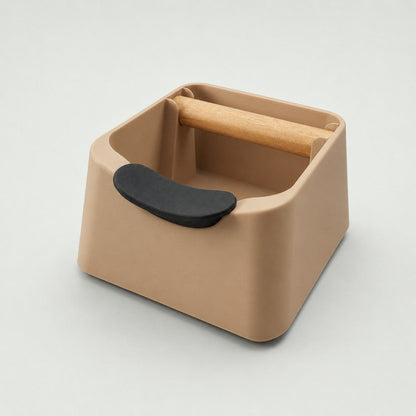 KNOCDIC® The Pod 3-in-1 espresso knock box with portafilter stand and oak wood knock bar in latte brown color.