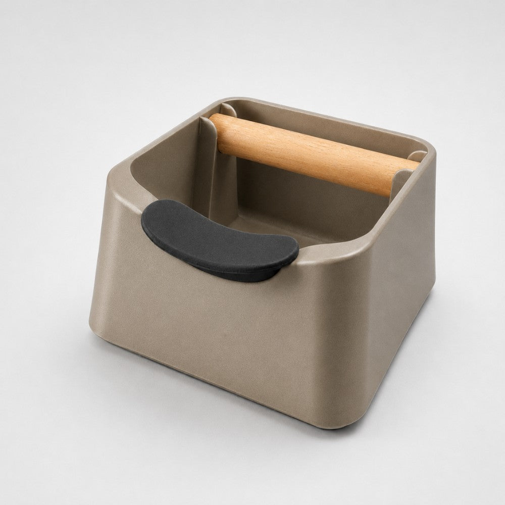 KNOCDIC® Pod 3-in-1 Espresso Knock Box with metallic gold finish, featuring portafilter stand and oak wood knock bar.