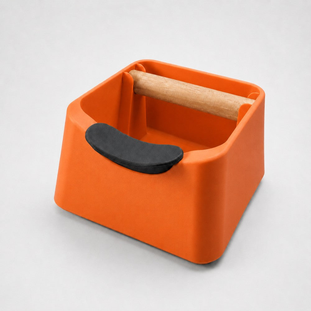 KNOCDIC® Pod 3-in-1 espresso knock box with orange finish, portafilter stand, and oak wood knock bar for coffee grounds disposal.
