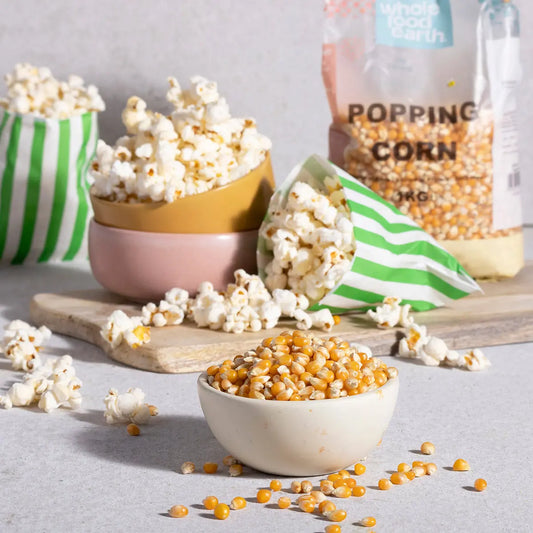 Bowl of freshly popped popcorn from ArtisanBox, showcasing fluffy, golden kernels in a cozy, inviting setting.