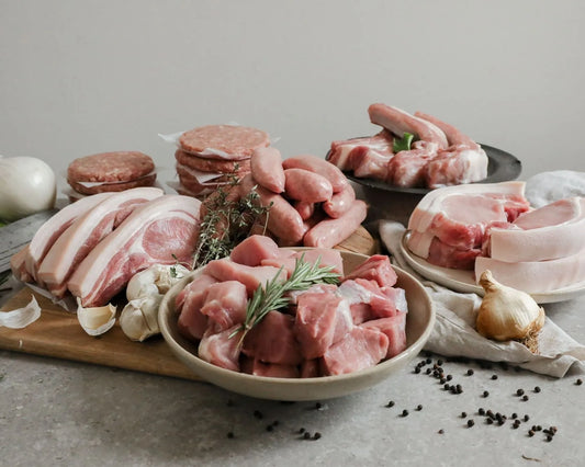 Large Primrose Herd Pork BBQ Pack featuring assorted pork cuts in a meat box, ready for grilling or barbecuing.