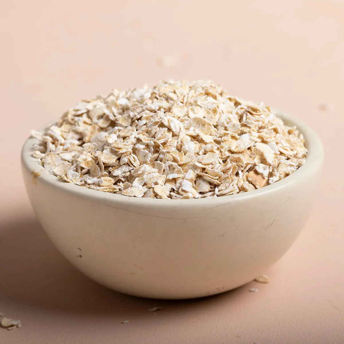 Whole Food Earth porridge oats cereal ingredients in a bowl, showing golden rolled oats and grains ready to cook.