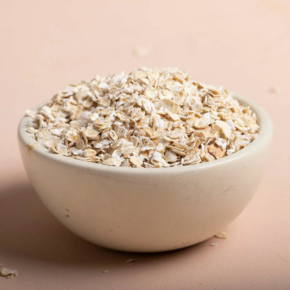 Whole Food Earth porridge oats cereal ingredients in a bowl, showing golden rolled oats and grains ready to cook.