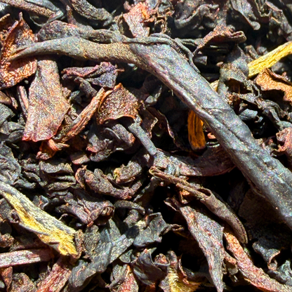 Loose leaf Lychee Congou Black Tea from Porter Hill Tea Company with dark, aromatic tea leaves and hints of lychee flavor.