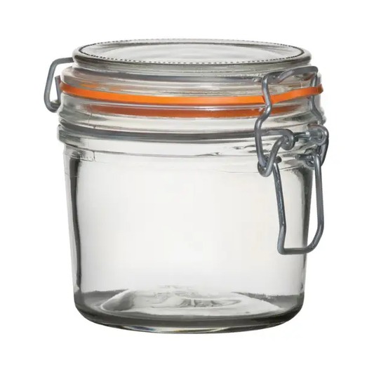 Glassware UK 350 ml terrine glass jar with a clear, round design and metal lid, ideal for food storage and presentation.