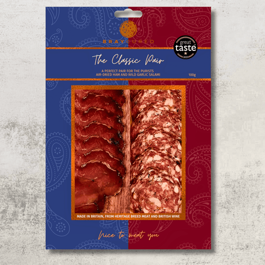 Assorted Bray Cured Classic Perfect Pair charcuterie selection with cured meats and cheeses on a wooden board.