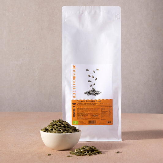 Raw organic pumpkin seeds by RAWGORILLA in 1kg bag, showing fresh green seeds with textured shells and natural appearance.
