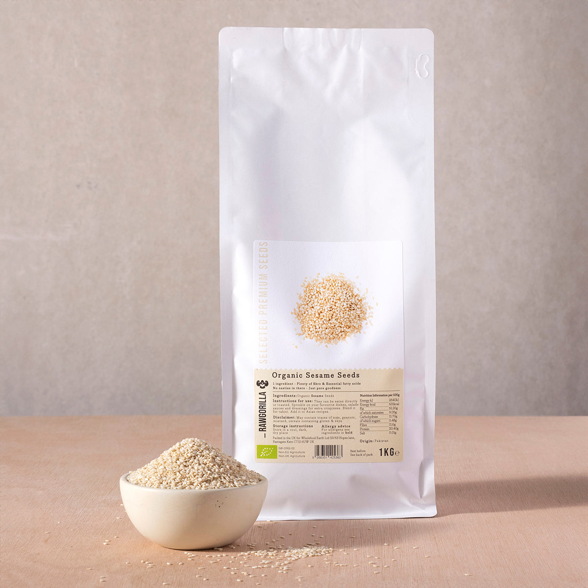 Organic sesame seeds from RAWGORILLA, 1kg, showing small, pale tan seeds in a clear container, part of Whole Food Earth nuts and seeds.