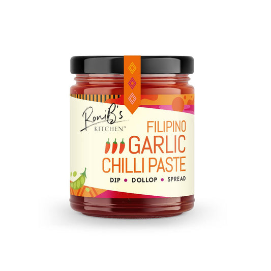 Vegan Filipino garlic chilli paste with Scotch bonnets in a jar, medium heat hot sauce from RoniBs Kitchen, vibrant red and orange colors.