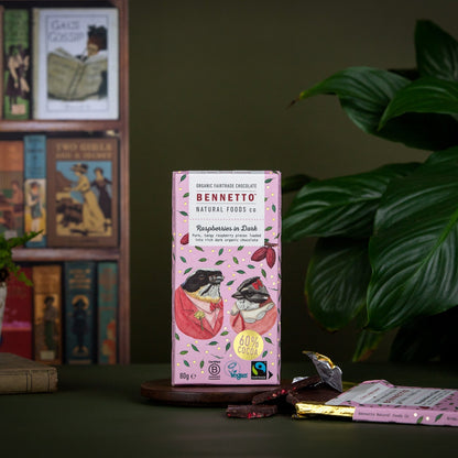 Dark chocolate with fresh raspberries from Bennetto Natural Foods UK, showing a close-up of raspberries embedded in rich dark chocolate.
