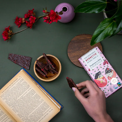 Dark chocolate with fresh raspberries from Bennetto Natural Foods UK, shown in a close-up of the chocolate and berry combination.