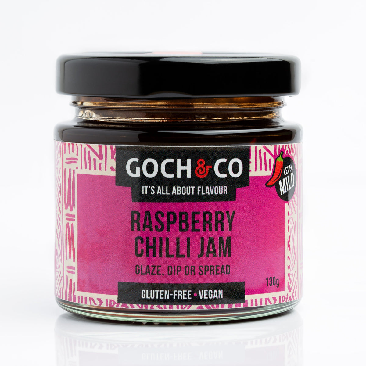 Jar of Goch & Co Raspberry Chilli Jam showing the label and vibrant red jam inside the jar.
