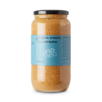 Organic crunchy peanut butter by RawGorilla in a jar, showcasing creamy texture with visible peanut pieces.