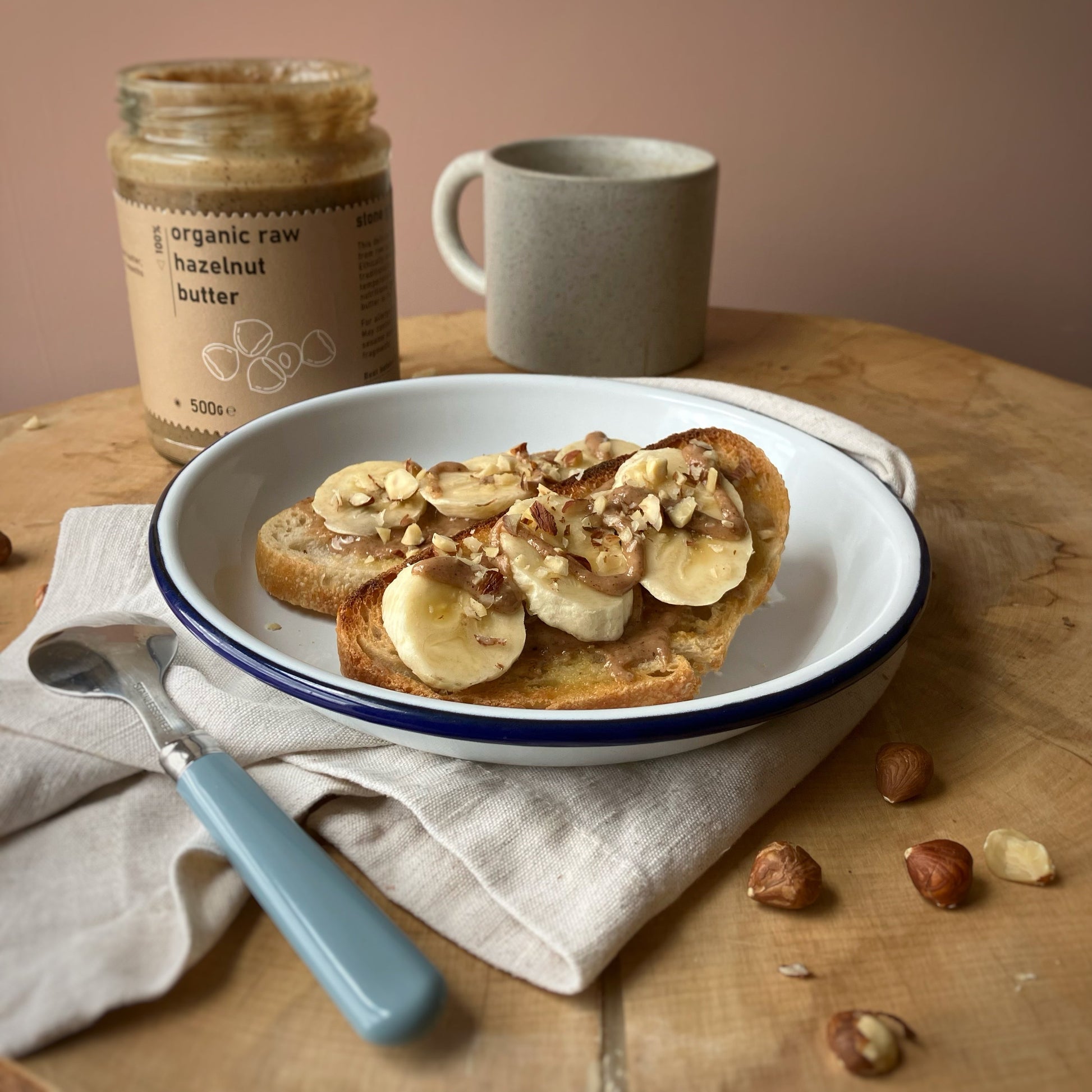 Organic Raw Hazelnut Butter by RawGorilla, smooth nut butter from Whole Food Earth, shown in a jar with a spoon.