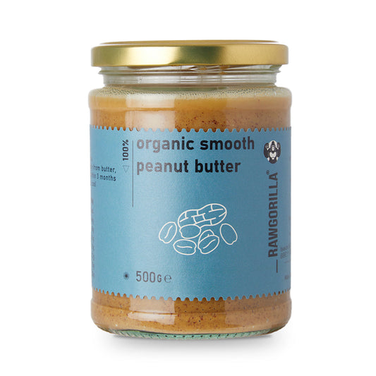 Creamy organic peanut butter from RawGorilla, displayed in a jar, showcasing its smooth texture and natural nutty color.