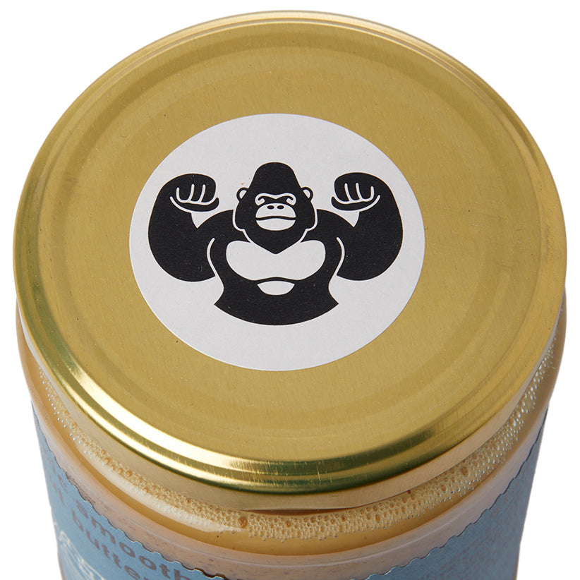 Creamy organic smooth peanut butter from RawGorilla in a jar, showcasing its natural, nutty texture and rich color.