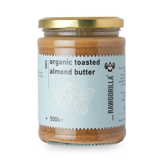 Organic toasted almond butter by RawGorilla in a jar, showcasing creamy almond spread with a natural, nutty texture.