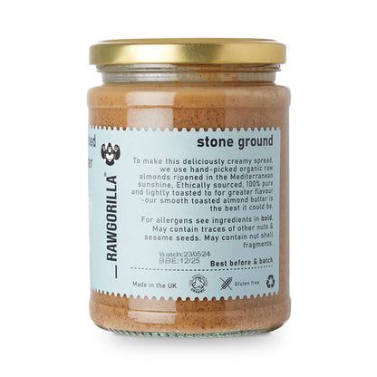 Organic toasted almond butter from RawGorilla, creamy nut butter spread in a jar, showcasing natural almond texture and branding.