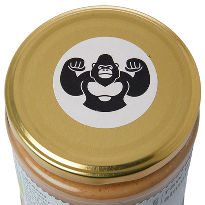 Creamy raw organic almond butter in a jar from RawGorilla, made with Whole Food Earth, showcasing its smooth, natural texture.
