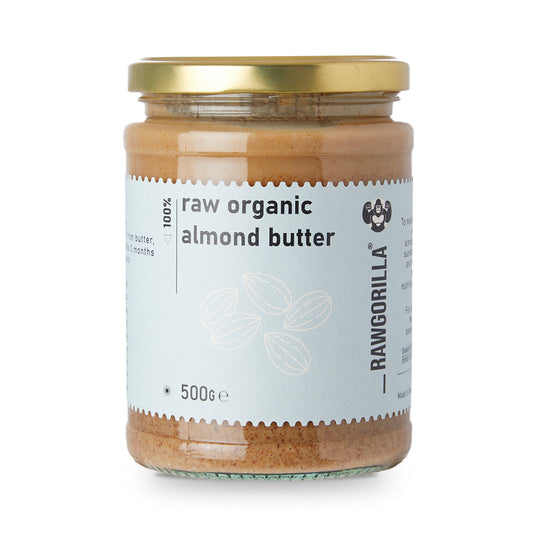 Creamy raw organic almond butter from RawGorilla, made with whole food earth, in a jar showing smooth almond spread