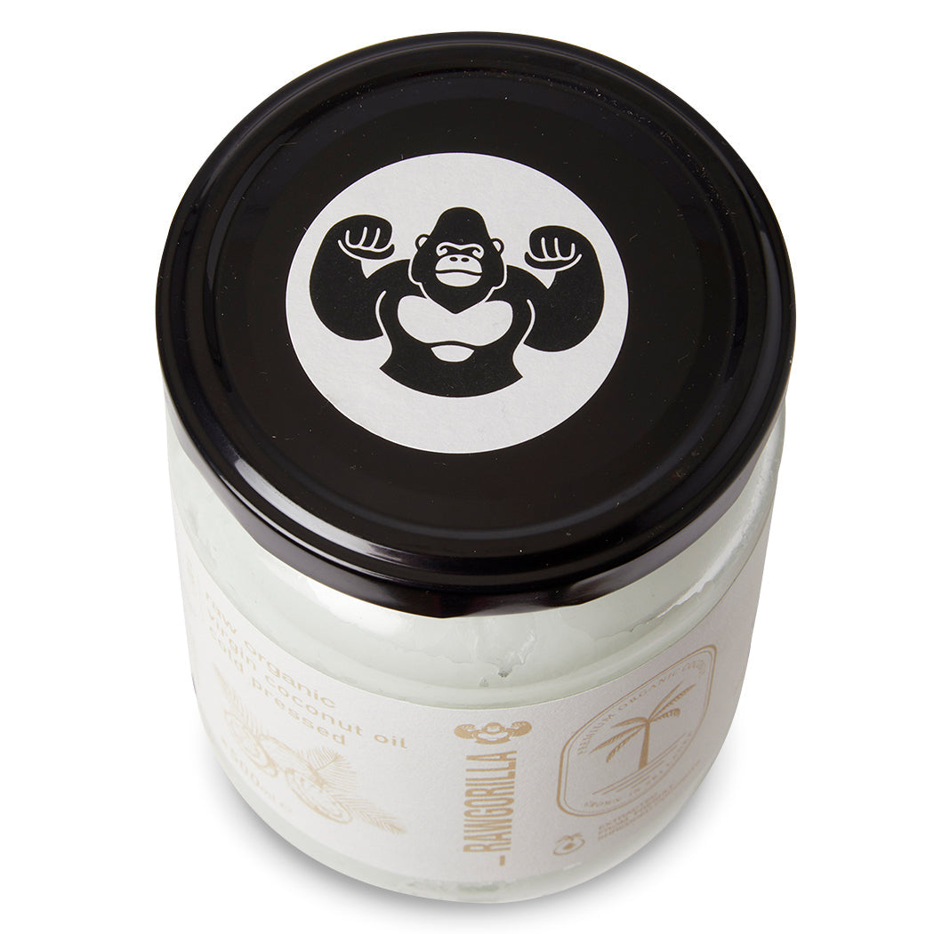 Raw Gorilla organic virgin coconut oil in a 500ml jar, natural cooking oil from Whole Food Earth with a clear label.
