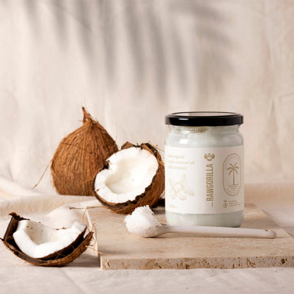 Raw organic virgin coconut oil in a 500ml jar from Whole Food Earth, suitable for cooking and skincare.